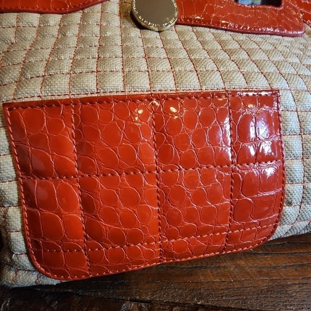 STUART WEITZMAN quilted tote with orange patent leather accents & gold hardware